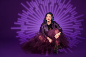 Woman in a tulle dress sitting on the ground, Mothe'rs Day portraits in Calgary